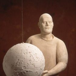 Plaster figure and globe